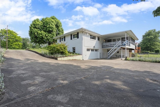 95 Karen Dr, Buffalo Twp Wsh, PA 15301 - view of front of property with concrete driveway, a garage, stairs, and brick siding