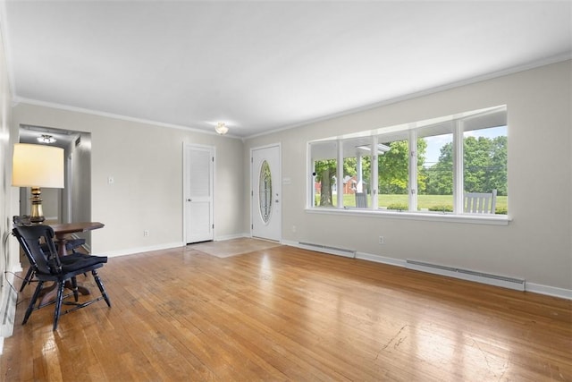 95 Karen Dr, Buffalo Twp Wsh, PA 15301 - unfurnished living room featuring a baseboard heating unit, light wood finished floors, and crown molding