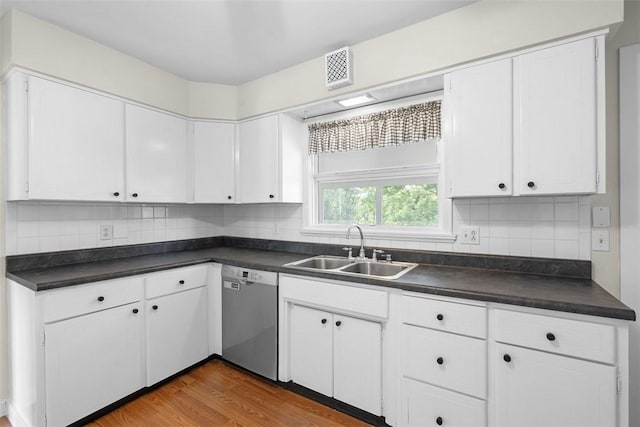 95 Karen Dr, Buffalo Twp Wsh, PA 15301 - kitchen featuring stainless steel dishwasher, dark countertops, white cabinetry, and wood finished floors