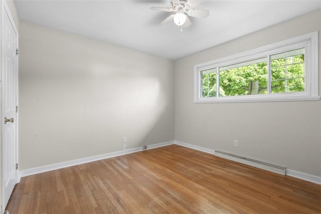 95 Karen Dr, Buffalo Twp Wsh, PA 15301 - empty room with a baseboard radiator, light wood-style floors, and a ceiling fan