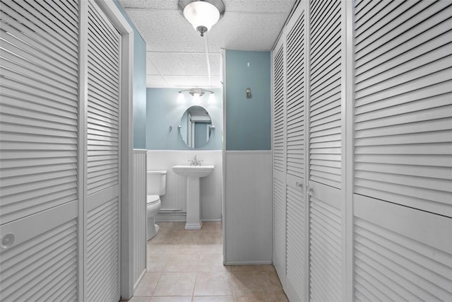 95 Karen Dr, Buffalo Twp Wsh, PA 15301 - bathroom featuring a closet, a paneled ceiling, tile patterned flooring, and a wainscoted wall