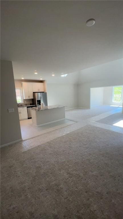 150 Shady River Blvd Unit 56A, Economy, PA 15005 - unfurnished living room with plenty of natural light, light colored carpet, and recessed lighting