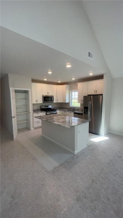 150 Shady River Blvd Unit 56A, Economy, PA 15005 - kitchen with stainless steel appliances, a center island, white cabinets, vaulted ceiling, and recessed lighting