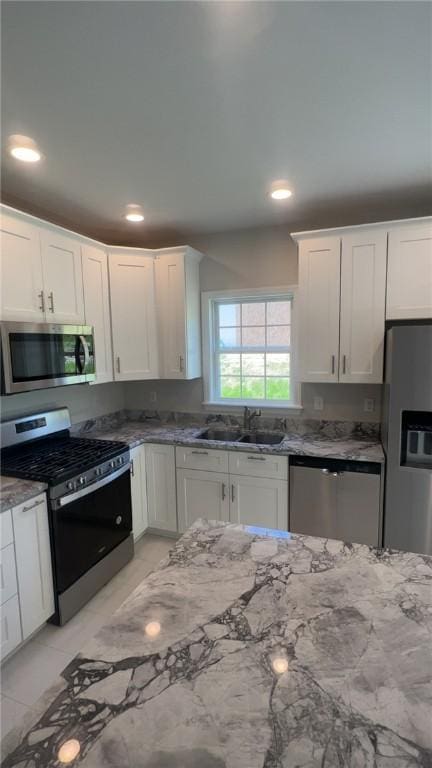 150 Shady River Blvd Unit 56A, Economy, PA 15005 - kitchen with stainless steel appliances, stone countertops, white cabinets, and recessed lighting