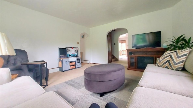 14099 Lincoln Way N, Huntingdon, PA 15642 - carpeted living room featuring arched walkways and baseboard heating
