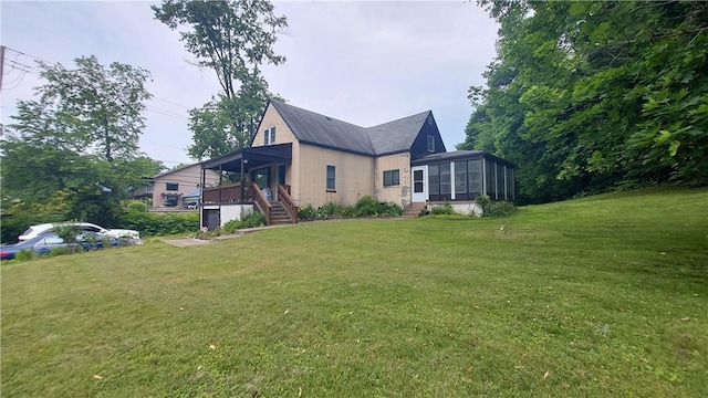 14099 Lincoln Way N, Huntingdon, PA 15642 - view of side of property featuring a sunroom, a lawn, and stairway