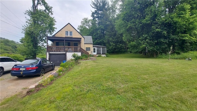 14099 Lincoln Way N, Huntingdon, PA 15642 - view of front facade with a front lawn, driveway, a garage, stairs, and a porch