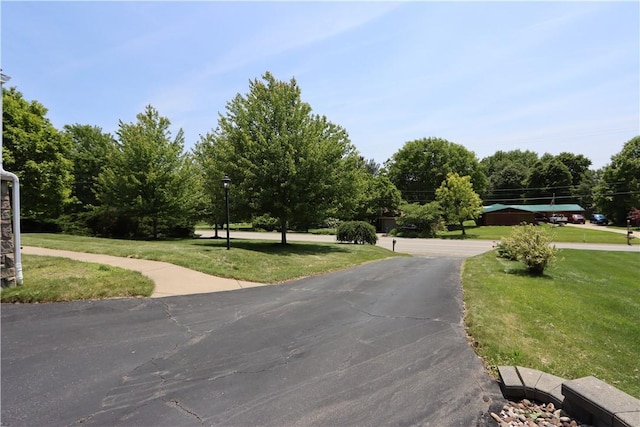 3244 37th St, Chippewa Twp, PA 15010 - view of asphalt driveway featuring street lighting