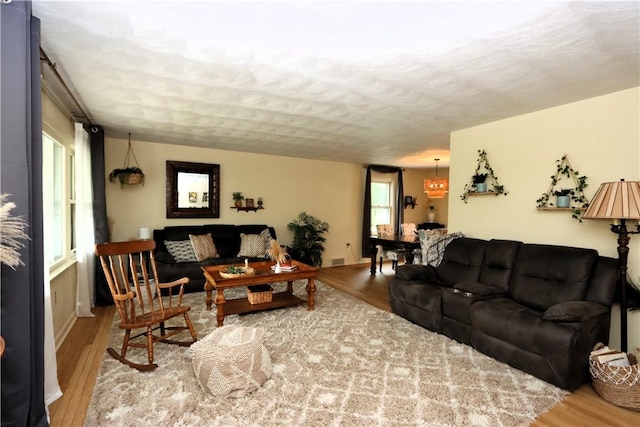 3244 37th St, Chippewa Twp, PA 15010 - living area featuring wood finished floors and a textured ceiling