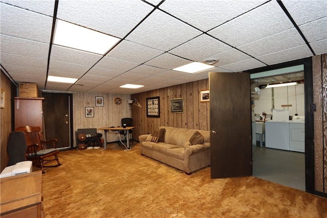 3244 37th St, Chippewa Twp, PA 15010 - carpeted living room featuring wooden walls, washing machine and clothes dryer, and a paneled ceiling