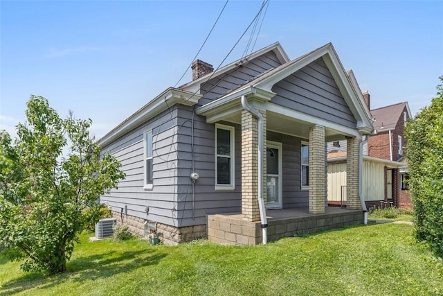 150 Frank St, Whitaker, PA 15120 - view of front of property with a front lawn, a chimney, and covered porch