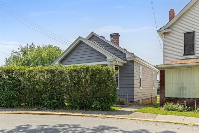 150 Frank St, Whitaker, PA 15120 - view of side of home with a chimney