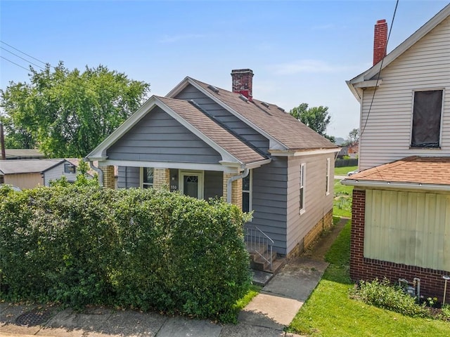 150 Frank St, Whitaker, PA 15120 - view of front of property with covered porch and a chimney