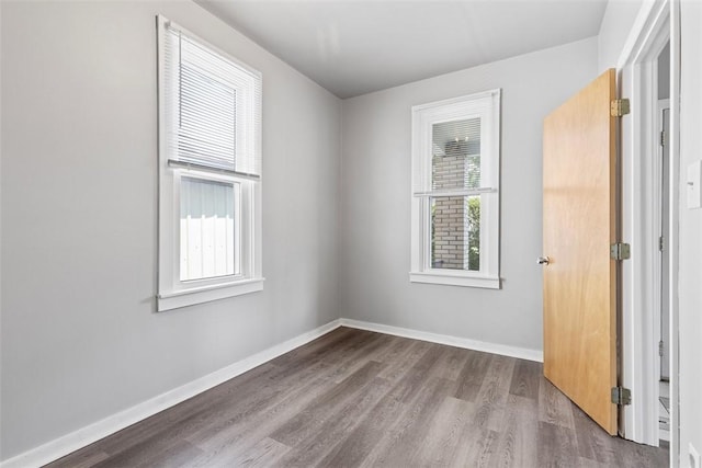 150 Frank St, Whitaker, PA 15120 - empty room with healthy amount of natural light and wood finished floors