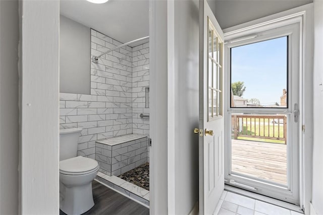 150 Frank St, Whitaker, PA 15120 - full bathroom featuring a tile shower, plenty of natural light, and tile walls
