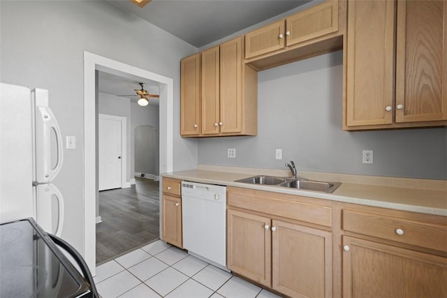 150 Frank St, Whitaker, PA 15120 - kitchen with white appliances, ceiling fan, light countertops, light tile patterned flooring, and arched walkways