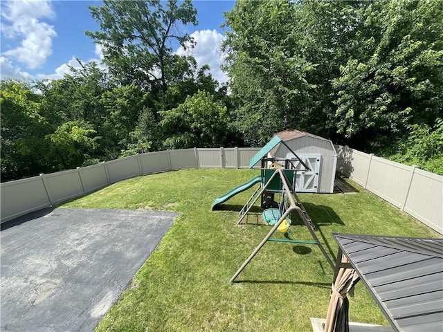 10240 Roseway Blvd, North Huntingdon, PA 15642 - fenced backyard featuring a playground, a shed, and a patio