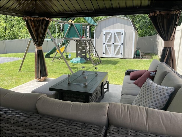 10240 Roseway Blvd, North Huntingdon, PA 15642 - fenced backyard featuring outdoor lounge area, a storage shed, a patio area, and a playground