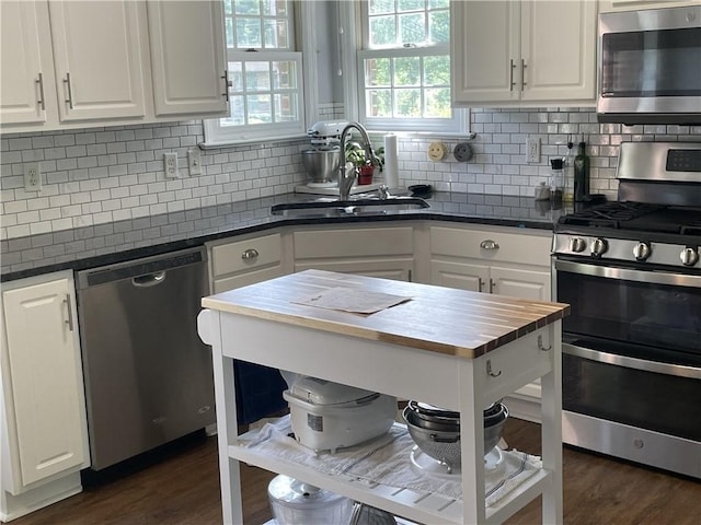 10240 Roseway Blvd, North Huntingdon, PA 15642 - kitchen with stainless steel appliances, butcher block countertops, and white cabinets