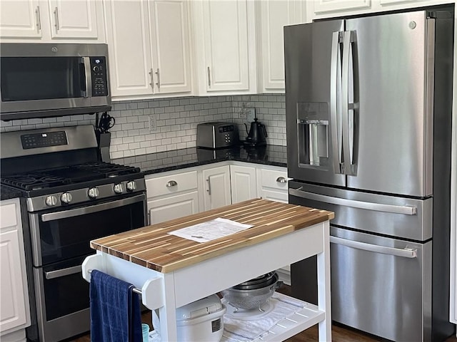 10240 Roseway Blvd, North Huntingdon, PA 15642 - kitchen with stainless steel appliances, wood counters, and white cabinets