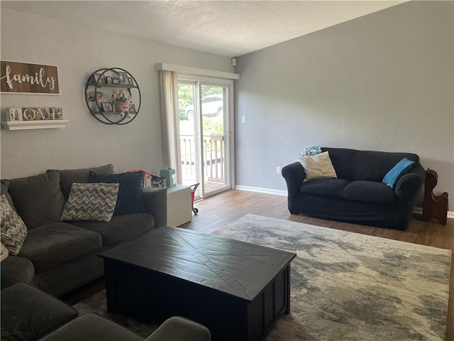 10240 Roseway Blvd, North Huntingdon, PA 15642 - living area featuring wood finished floors and a textured ceiling