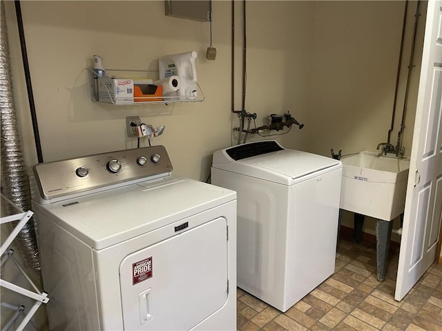 10240 Roseway Blvd, North Huntingdon, PA 15642 - washroom with washer and dryer and brick patterned flooring