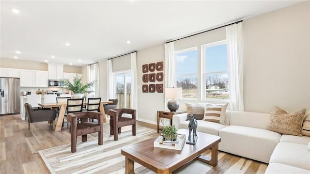 346 Leslie Farms Dr, Connoquenessing Boro, PA 16033 - living room with healthy amount of natural light, light wood-style floors, and recessed lighting