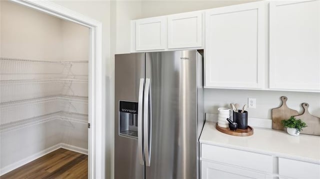 346 Leslie Farms Dr, Connoquenessing Boro, PA 16033 - kitchen featuring stainless steel fridge with ice dispenser, white cabinets, light countertops, and dark wood-type flooring
