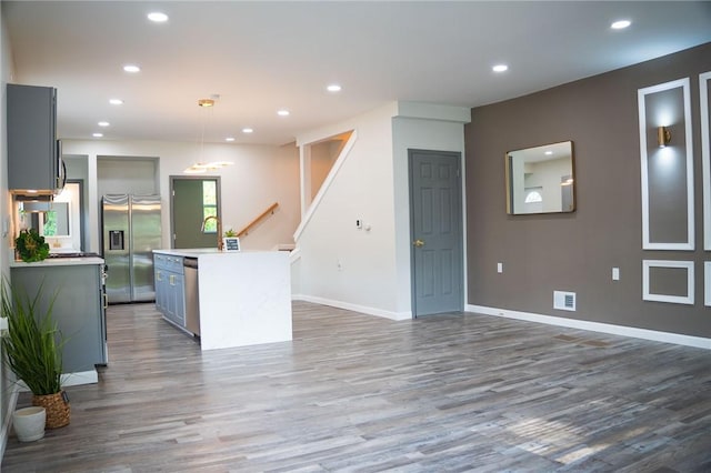 428 Donna, Garfield, PA 15224 - kitchen with appliances with stainless steel finishes, wood finished floors, a kitchen island, recessed lighting, and gray cabinets