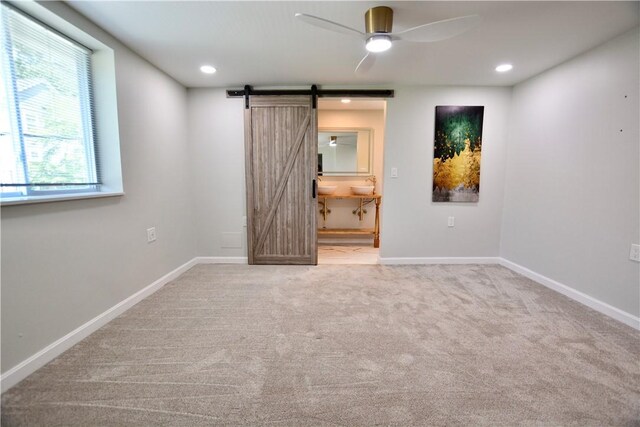 428 Donna, Garfield, PA 15224 - unfurnished bedroom with a barn door, carpet flooring, ensuite bath, and recessed lighting