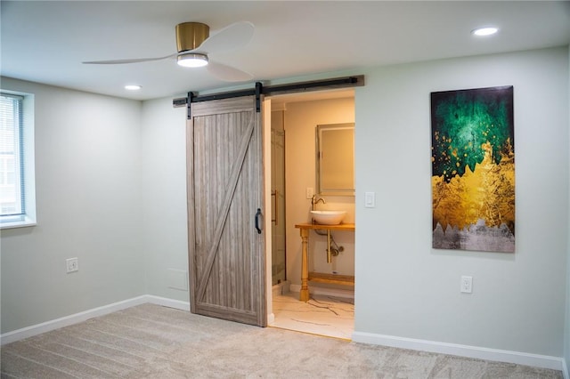 428 Donna, Garfield, PA 15224 - unfurnished bedroom featuring a barn door, carpet floors, recessed lighting, ensuite bath, and ceiling fan