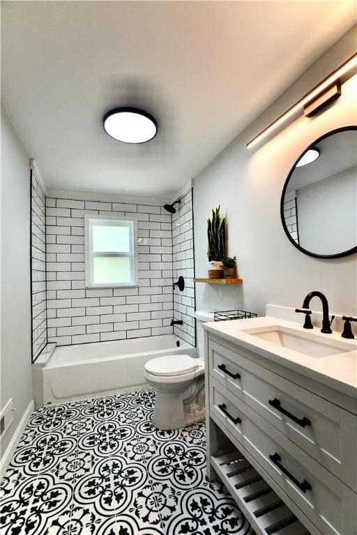 428 Donna, Garfield, PA 15224 - bathroom featuring vanity, tub / shower combination, and tile patterned flooring