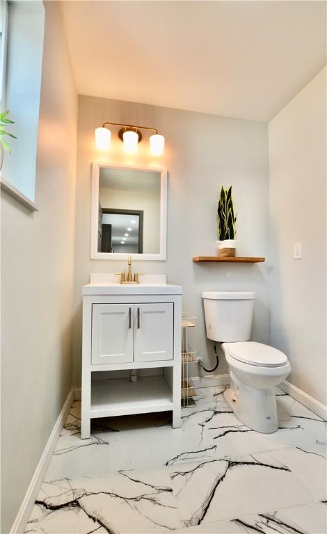 428 Donna, Garfield, PA 15224 - bathroom with marble look tile flooring and vanity