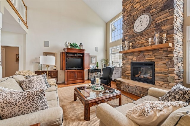 1041 Ashfield Way, Salem Twp Wml, PA 15601 - living room featuring high vaulted ceiling, wood finished floors, and a fireplace