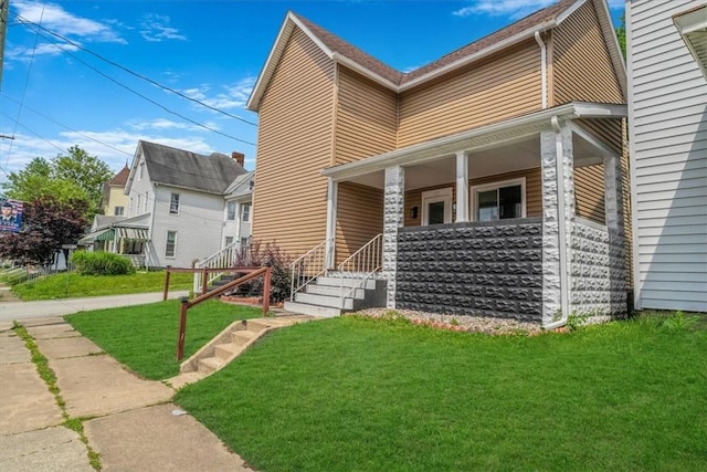 322 S Broadway St, Scottdale, PA 15683 - view of front of house featuring covered porch and a front lawn