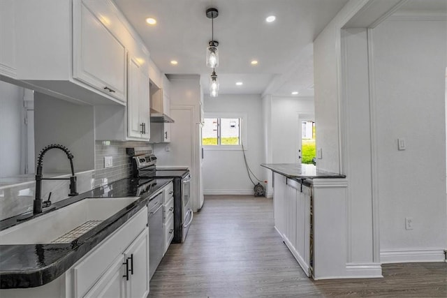 322 S Broadway St, Scottdale, PA 15683 - kitchen featuring stainless steel appliances, wood finished floors, tasteful backsplash, white cabinetry, and recessed lighting