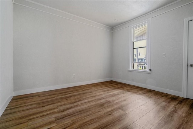 322 S Broadway St, Scottdale, PA 15683 - empty room featuring wood finished floors and ornamental molding