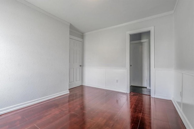322 S Broadway St, Scottdale, PA 15683 - unfurnished bedroom featuring wood finished floors, ornamental molding, and a wainscoted wall