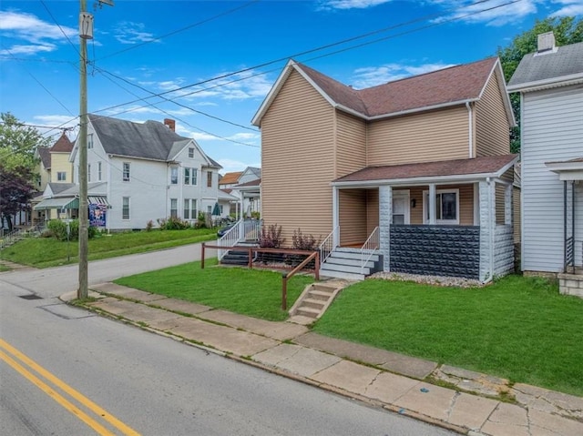 322 S Broadway St, Scottdale, PA 15683 - view of front of house with covered porch, a residential view, and a front yard