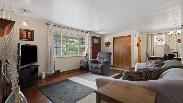 1657 Pembroke Dr, Pittsburgh, PA 15243 - living area featuring wood finished floors and a chandelier