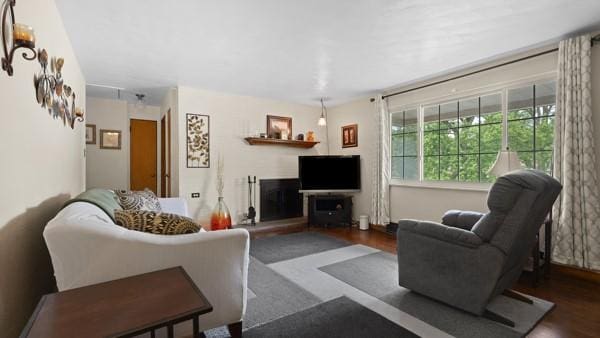1657 Pembroke Dr, Pittsburgh, PA 15243 - living area featuring wood finished floors and a fireplace