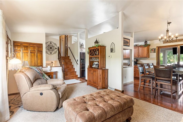 223 Horseshoe Dr, Adams Twp, PA 16046 - carpeted living room featuring stairs, a chandelier, and lofted ceiling