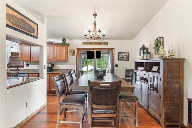 223 Horseshoe Dr, Adams Twp, PA 16046 - dining area with a chandelier and dark wood-type flooring