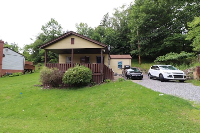 1700 Grall Ave, Shaler, PA 15209 - bungalow-style house with a front lawn, driveway, and a porch