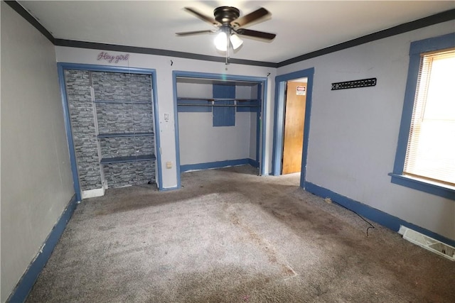 1700 Grall Ave, Shaler, PA 15209 - unfurnished bedroom with ornamental molding, carpet floors, multiple closets, and a ceiling fan