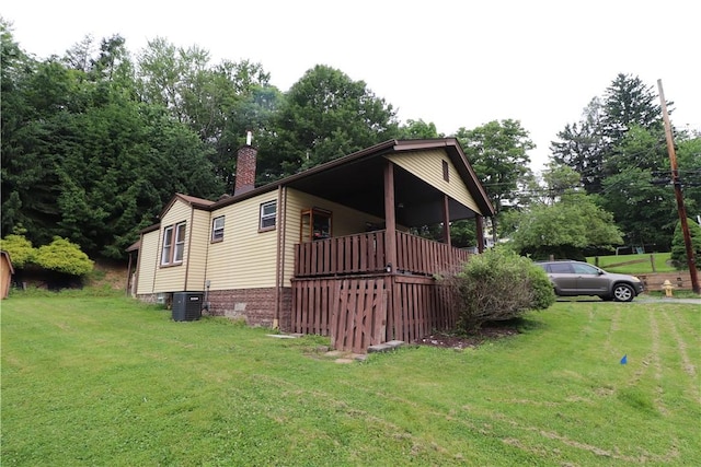 1700 Grall Ave, Shaler, PA 15209 - view of home's exterior with a yard, a chimney, and view of wooded area