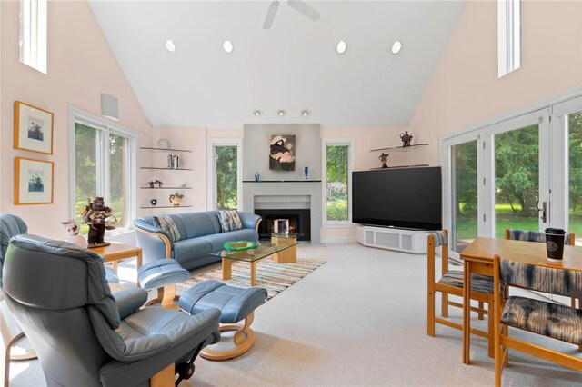 241 W Chapel Ridge Rd, Fox Chapel, PA 15238 - living room with high vaulted ceiling, a warm lit fireplace, light colored carpet, a ceiling fan, and recessed lighting
