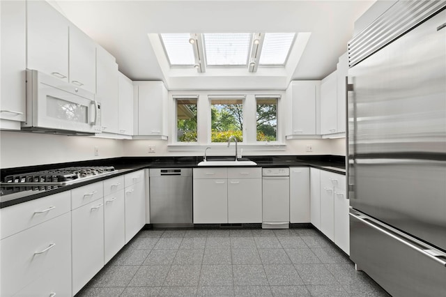 241 W Chapel Ridge Rd, Fox Chapel, PA 15238 - kitchen with appliances with stainless steel finishes, granite floors, white cabinetry, and dark countertops