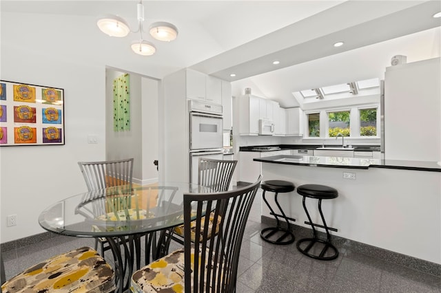 241 W Chapel Ridge Rd, Fox Chapel, PA 15238 - dining room with recessed lighting, vaulted ceiling, and granite floors