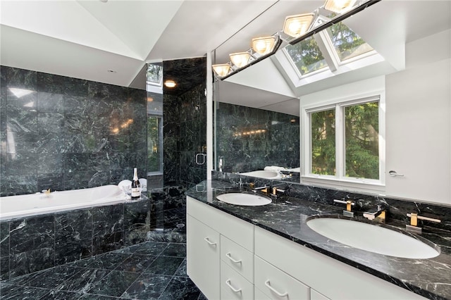 241 W Chapel Ridge Rd, Fox Chapel, PA 15238 - full bathroom featuring a bath, double vanity, marble finish floors, tile walls, and lofted ceiling